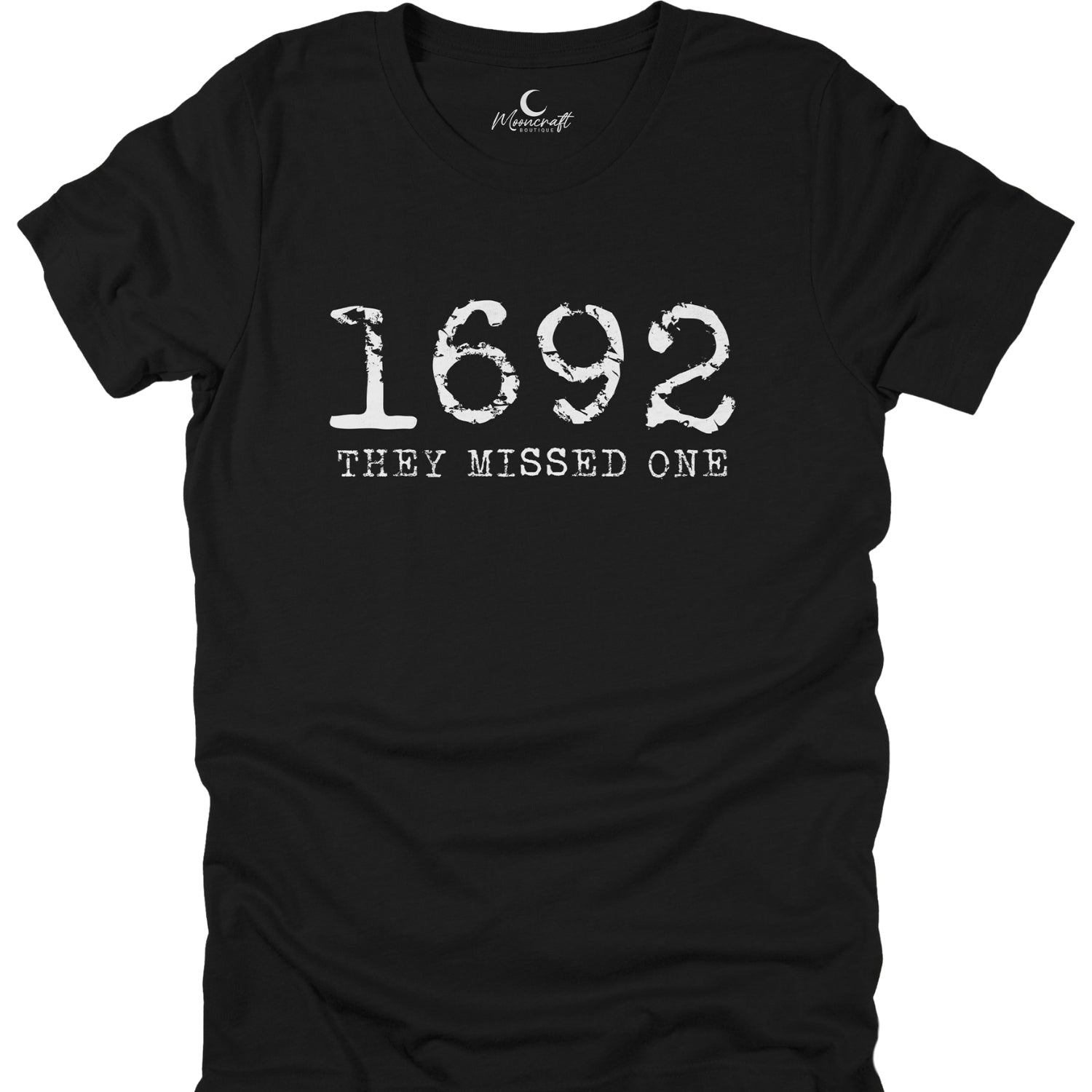 Black t-shirt with white text '1692 THEY MISSED ONE' on a white background