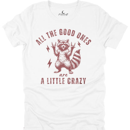 White t-shirt with a raccoon graphic and the text All the good ones are a little crazy