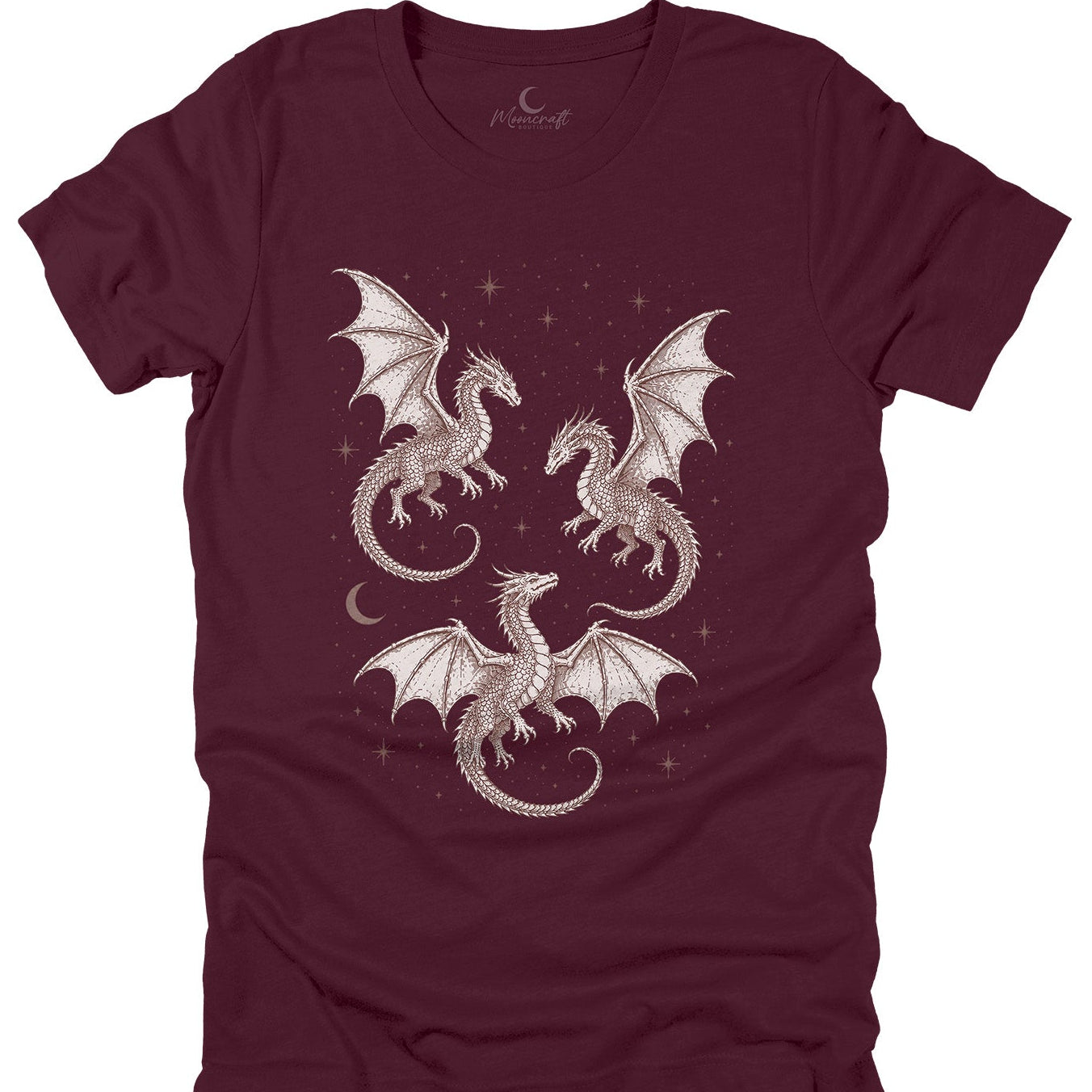 A maroon short-sleeve t-shirt with a graphic print of three white dragons flying amidst stars and a crescent moon