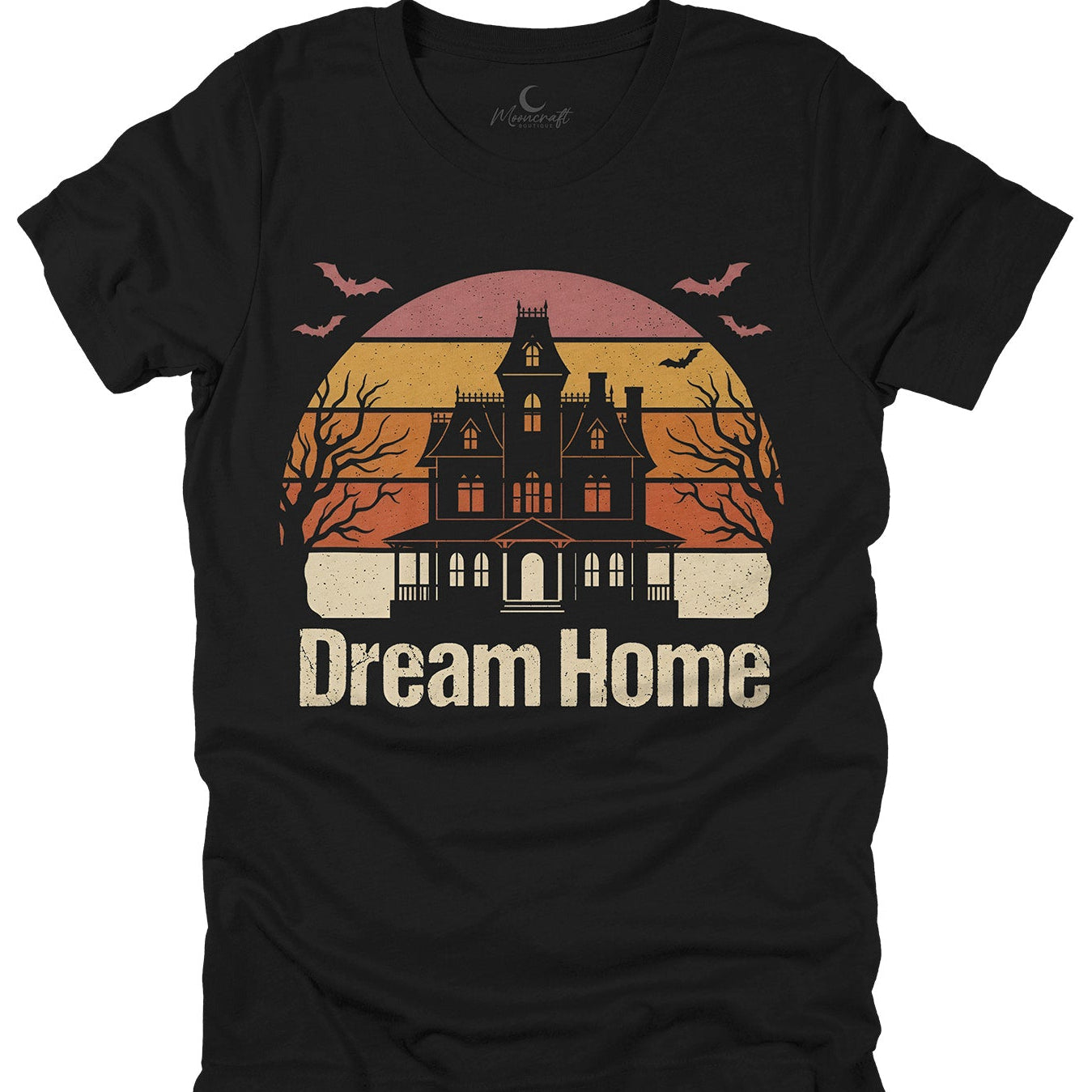 Black t-shirt with a haunted house on a retro sunset graphic and 'Dream Home' text on a white background