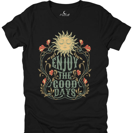 Black t-shirt with sun and floral design and 'Enjoy the Good Days' text on a white background