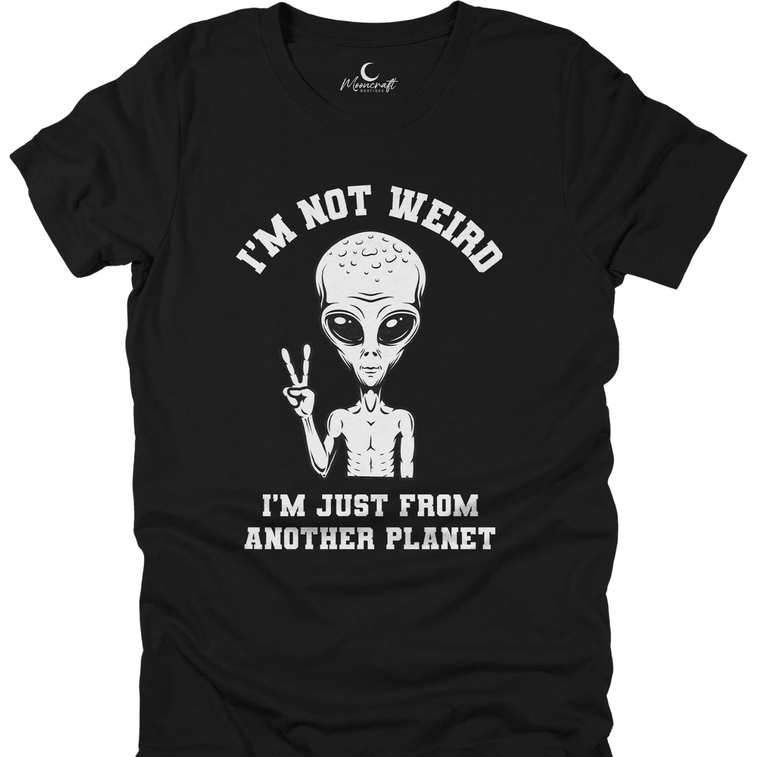 Black t-shirt with alien graphic and text 'I'm not weird, I'm just from another planet' on a white background.