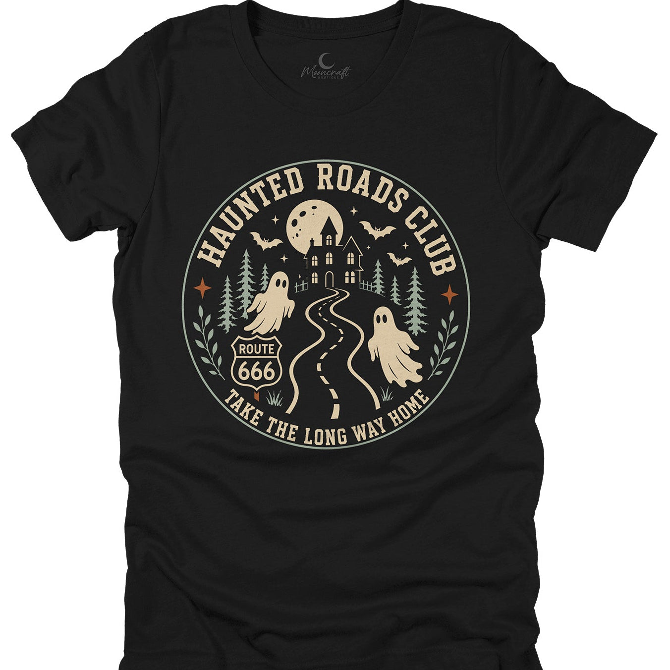 A black short-sleeve t-shirt with a circular vintage-style graphic on the front. The graphic features a haunted house, a full moon, bats, pine trees, two ghosts, a winding road, and the text 'HAUNTED ROADS CLUB' and 'TAKE THE LONG WAY HOME' in beige.