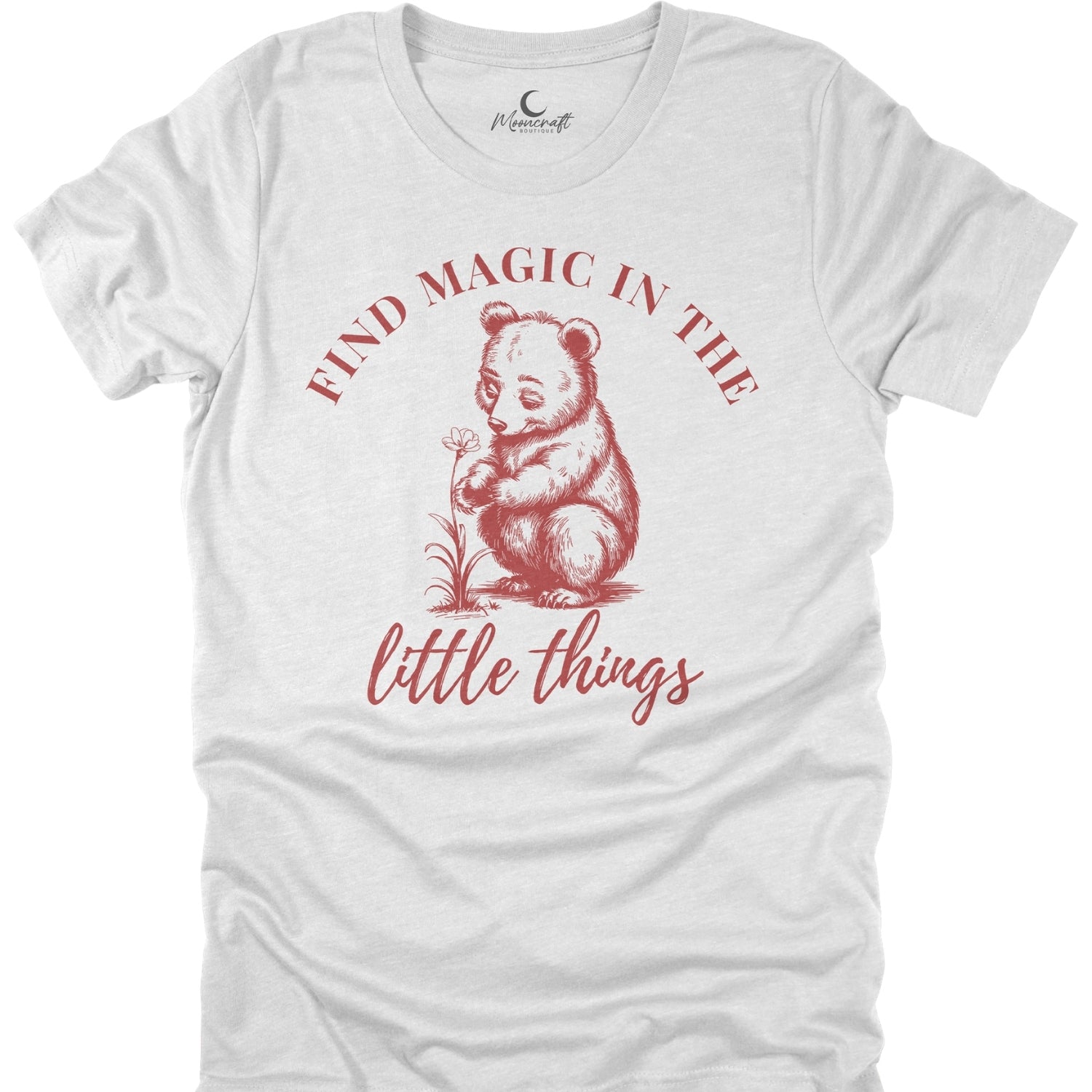 White t-shirt with red bear graphic and text 'Find magic in the little things' on a white background