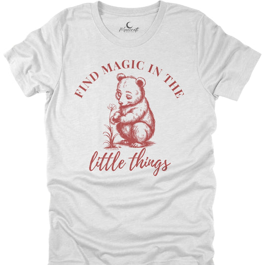 White t-shirt with red bear graphic and text 'Find magic in the little things' on a white background