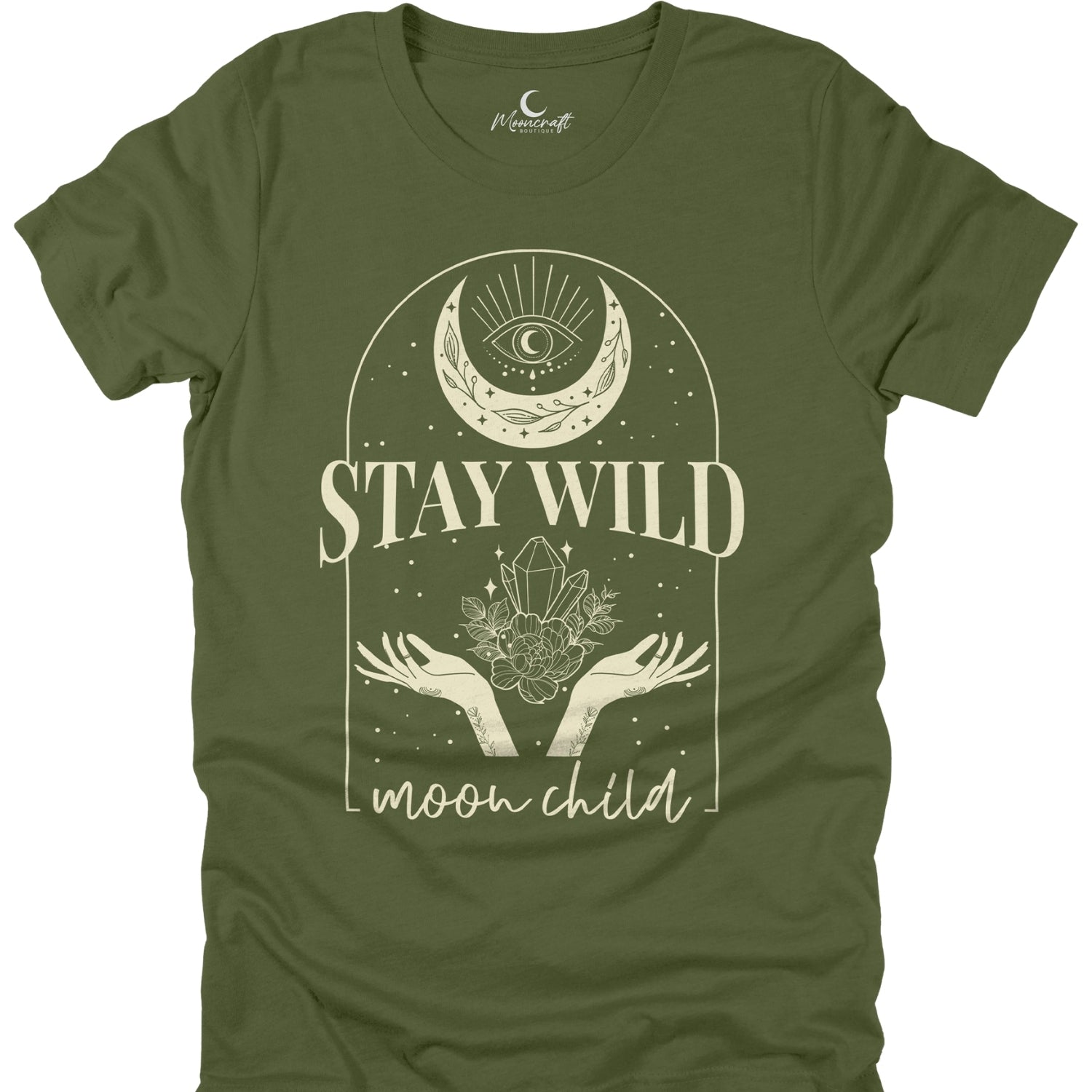 Green t-shirt with 'Stay Wild Moon Child' design featuring a moon, hands, and crystal on a white background.