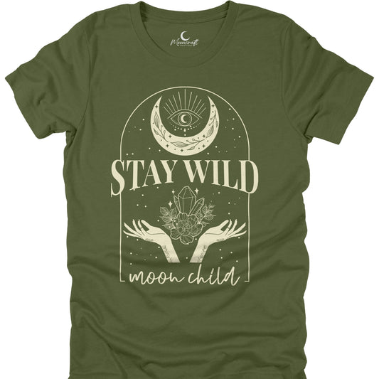 Green t-shirt with 'Stay Wild Moon Child' design featuring a moon, hands, and crystal on a white background.