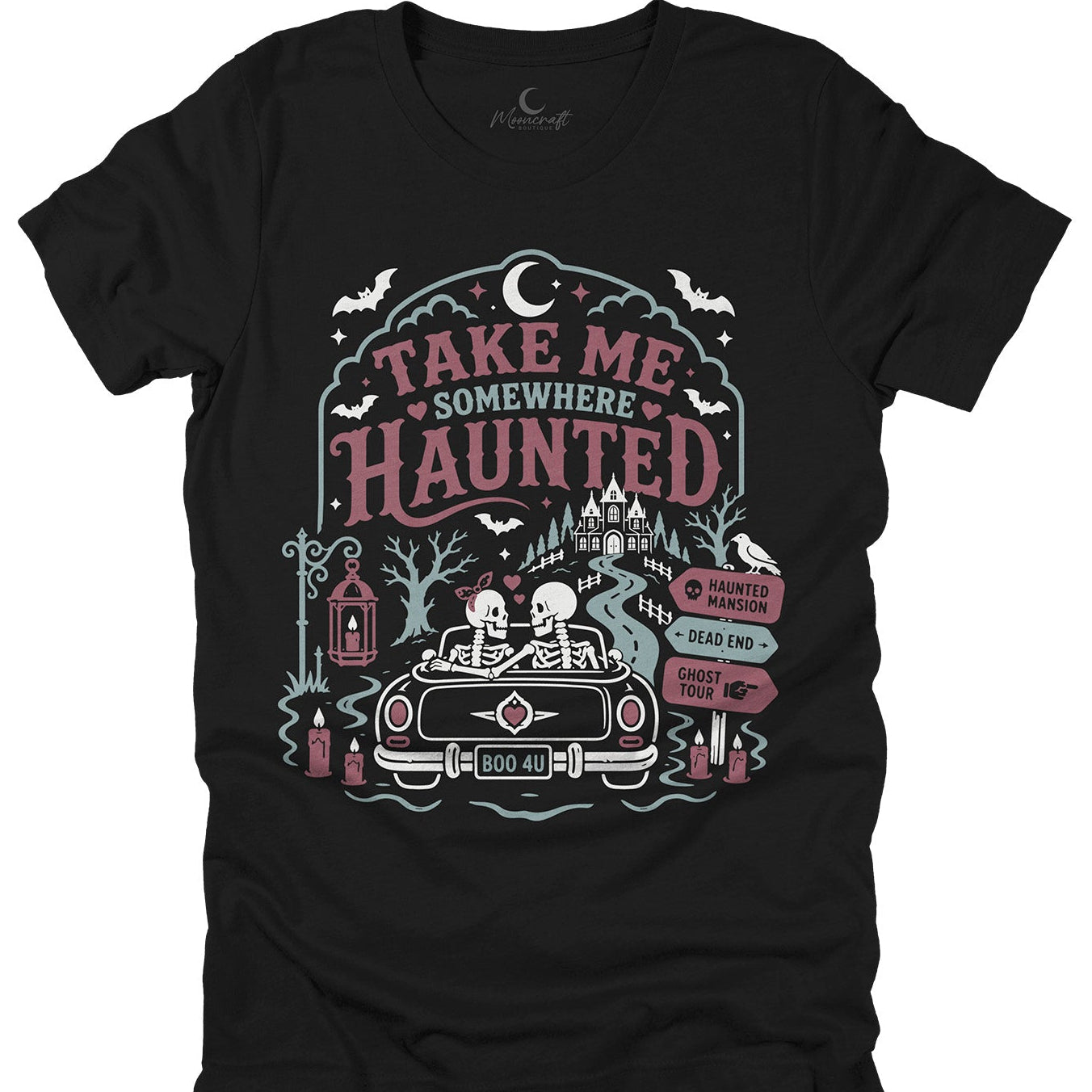Black t-shirt with 'Take Me Somewhere Haunted' graphic design featuring a car, skeletons, and haunted castle.