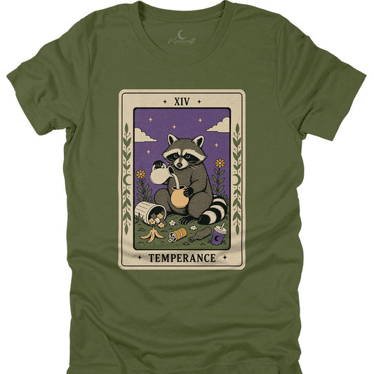 An olive green short-sleeve t-shirt with a central graphic of a tarot card depicting a raccoon, labeled 'XIV TEMPERANCE'.