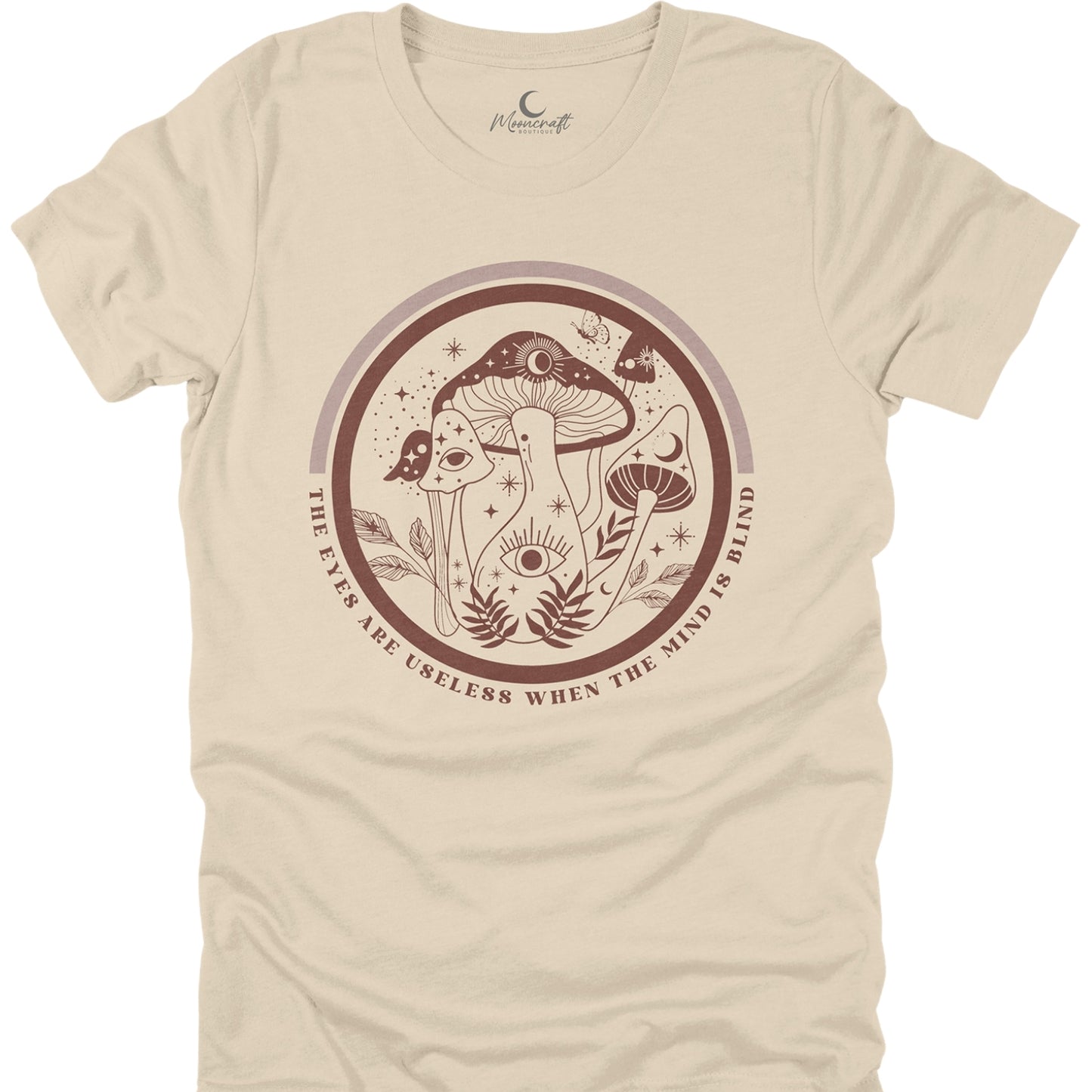 Beige t-shirt with mushroom design and text on a white background