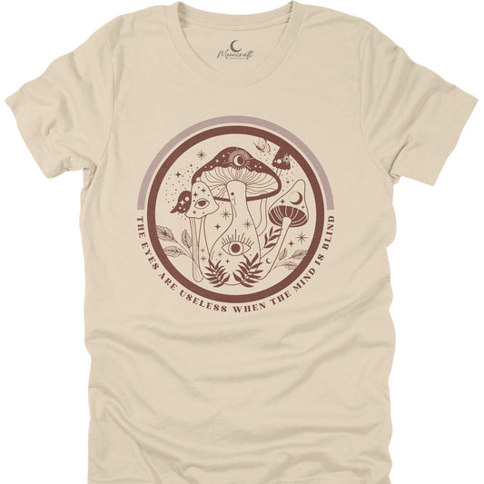 Beige t-shirt with mushroom design and text on a white background