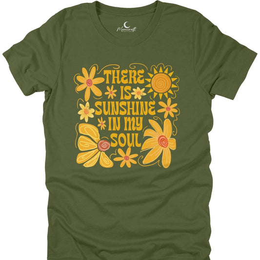 Green t-shirt with yellow floral design and text 'There is sunshine in my soul' on a white background