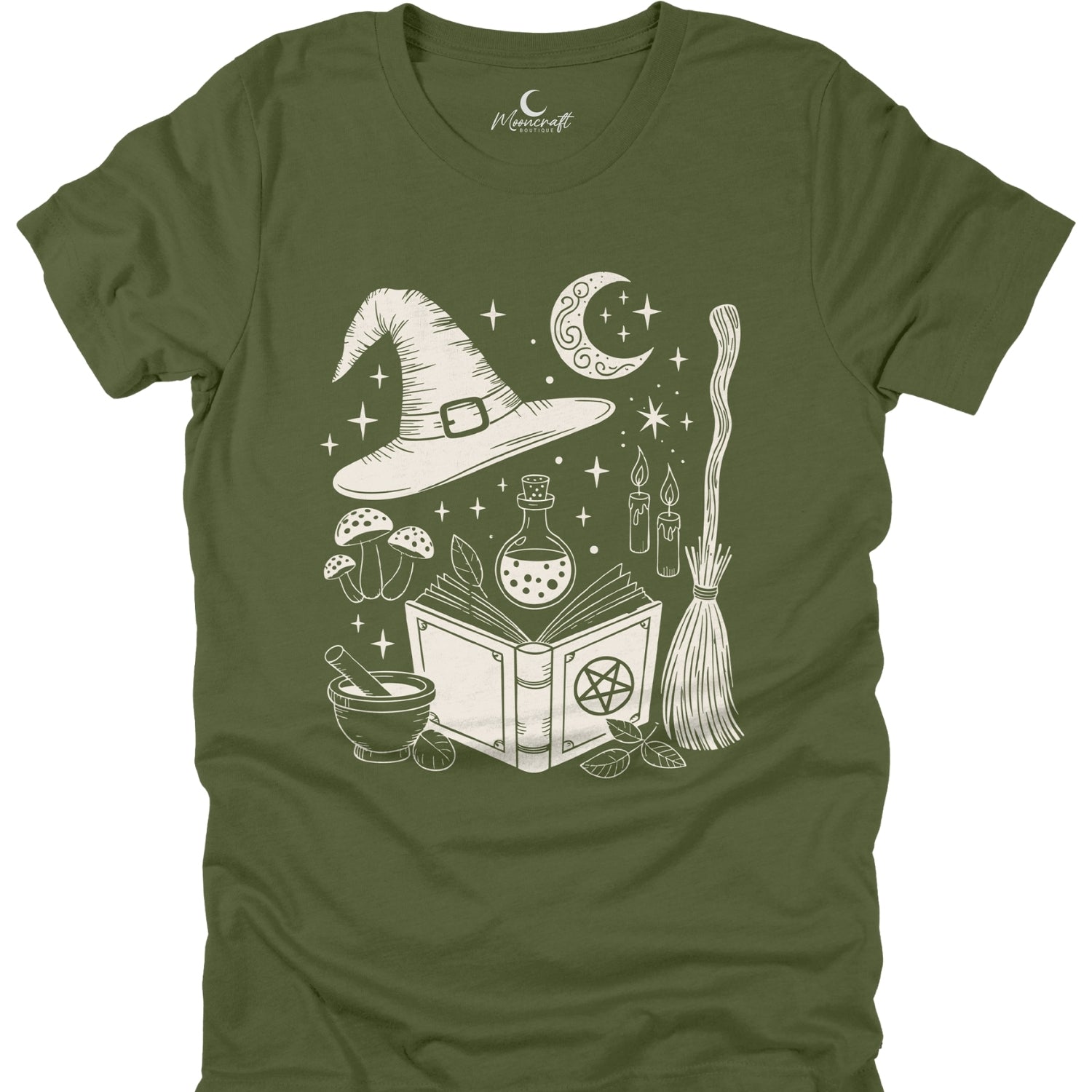 Green t-shirt with white witch-themed graphic on a white background